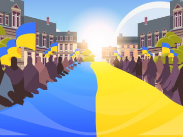 People on either side of the Ukrainian flag