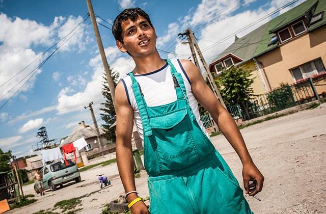 Roma man outside housing in Hungary